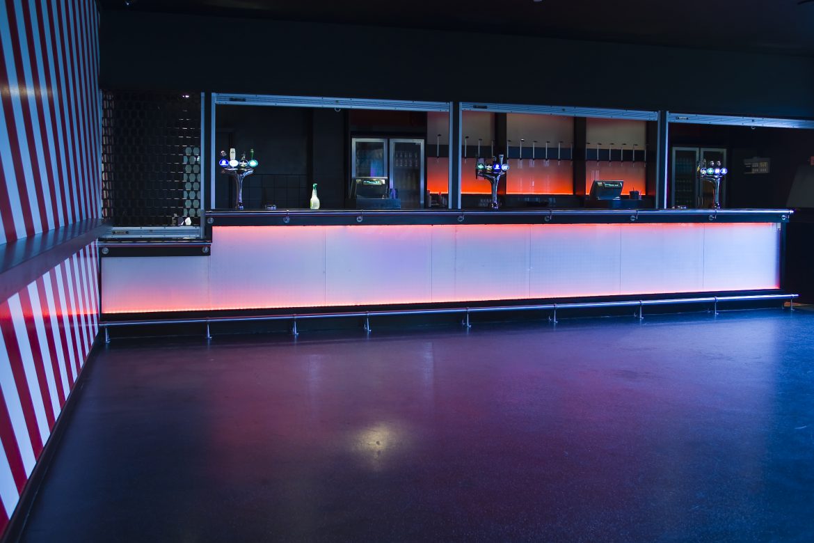Dark Quartz Trowelled flooring systems in Student Union Nightclub with bar area- mma flooring systems for anti slip flooring